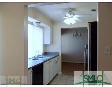 Kitchen. Galley kitchen has sunny window, stainles