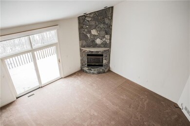 The vaulted ceiling family room has over sized doo