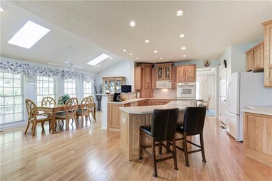 Follow the HW floors into this massive eat-in kitc