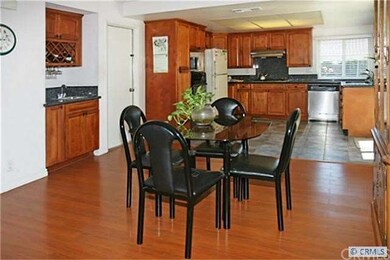 Dining Room with Custom Wet Bar and Kitchen