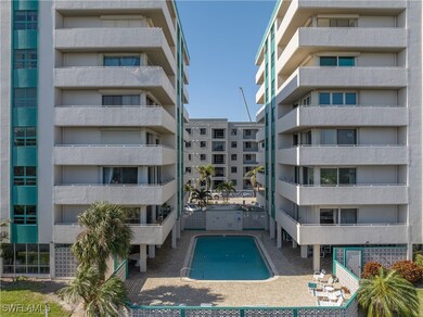View of property with a community pool