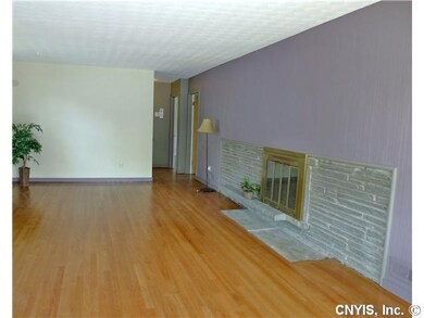 Living Room. Refinished hardwood floor and wood bu
