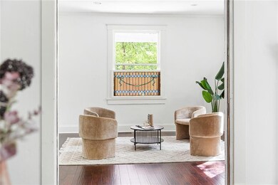 Sitting room featuring ornamental molding and hardwood / wood-style floors