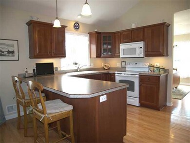 Kitchen. Light, bright kitchen with cherry cabinet