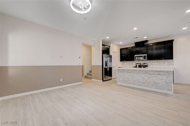Kitchen with light countertops, light wood-style f