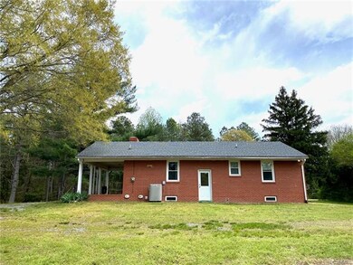 Rear of Home. New heat pump with gas backup, door 