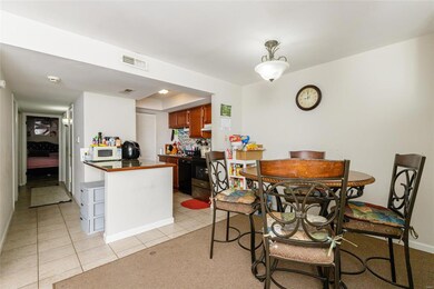 Breakfast room with view into the kitchen.