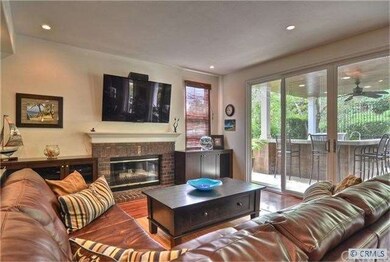 Spacious Family Room with Cozy Brick Fireplace and