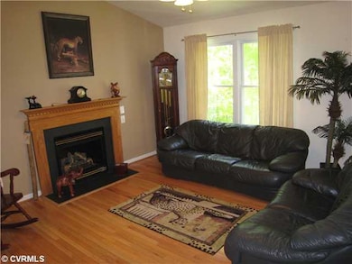 Living Room - Warm solid oak hardwood floors, gas 