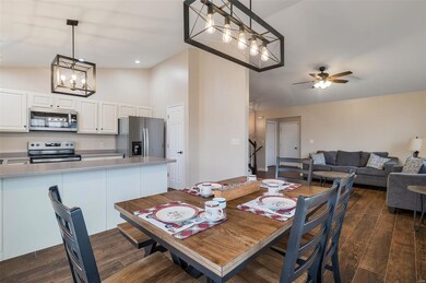 Dining space with notable chandelier and vaulted ceiling