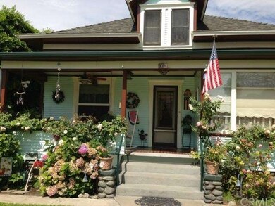 Large front porch with ample seating and ceiling f