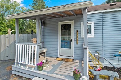 Open porch with entry to mudroom/foyer