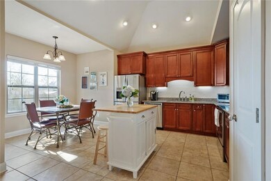 Kitchen has wood cabinets, under cabinet lighting
