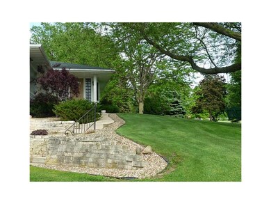 Entryway. Beautiful stone and landscaping