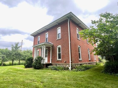 The original ornate Craftsman front porch was rebu