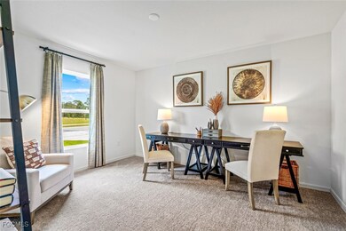 Office space featuring carpet flooring and baseboa