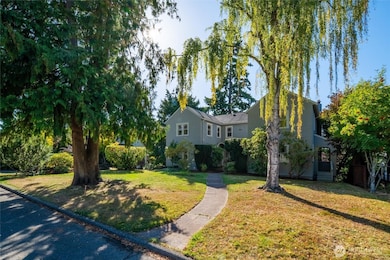 Double lot has mature shade trees, plenty of space to garden.