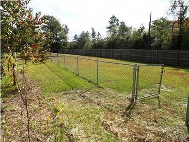PRIVACY FENCING WITH CHAINLINK FENCING INSIDE CREATING A DOG RUN, ETC.