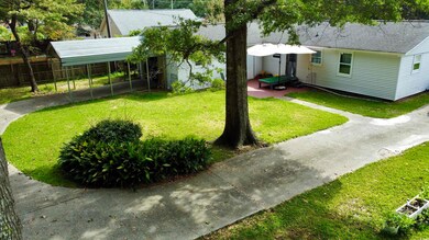 View of yard with a carport