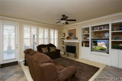 Cozy family room along wall of windows.