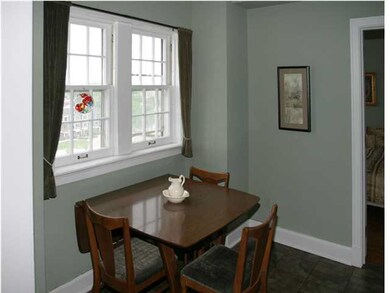 Lovely formal dining area with slate colored vinyl