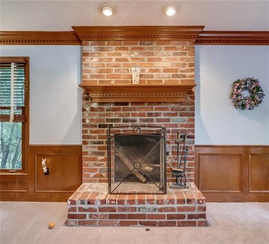 Woodwork, wainscoting, crown molding and a brick f