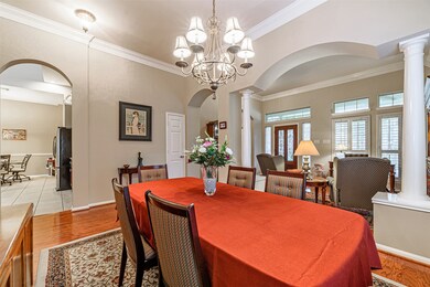 The dining room has wood floors and is located just off the kitchen which is perfect for entertaining.