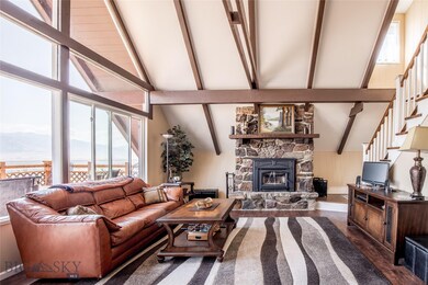 Open Great room with a wall of windows and access
