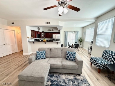 Living room with light wood-type flooring and a ce