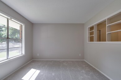Living Room featuring brand new carpet flooring, b