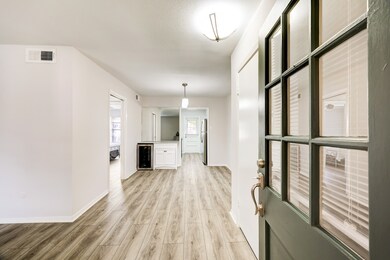 Entering the condo, the spacious living room is to