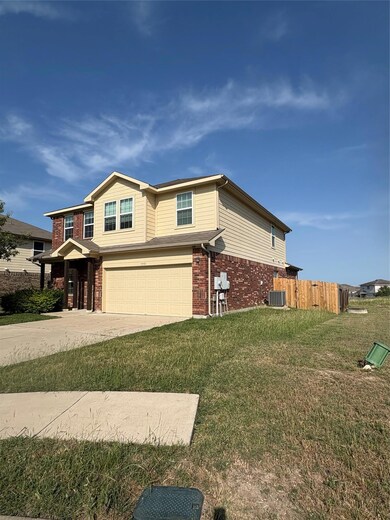 View of side of property featuring an attached ga