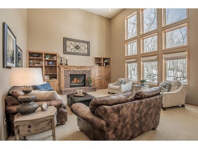 Impressive 2- story family room highlights brick g