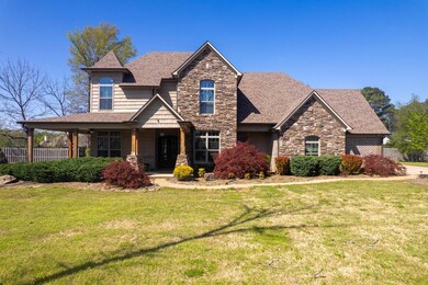 Craftsman-style home featuring a front yard, fence
