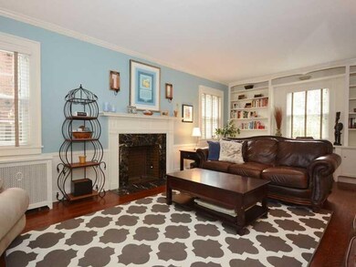 Living Room. Marble surround on fireplace adds to 