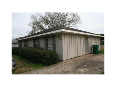 Exterior Back. Entrance door is on side of duplex
