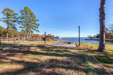 View of deck with 2 boat slips, 1 jet ski lift and