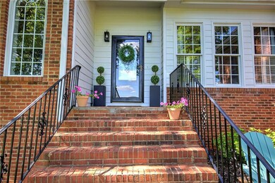 View of exterior entry with brick siding
