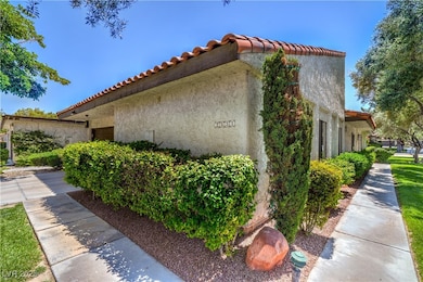 View of side of home featuring stucco siding and a