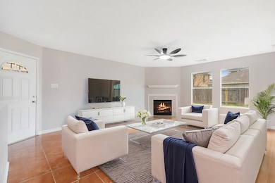 Spacious Living Room with corner fireplace.