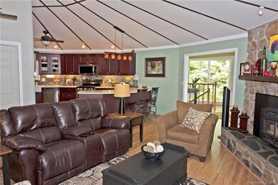 Open living area, stone hearth with cast iron wood