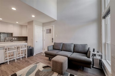 Living area featuring light wood-style floors and