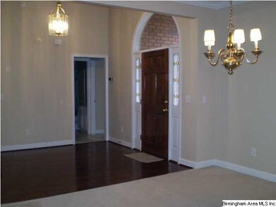 LIVING ROOM ENTRY WITH WOOD FLOOR