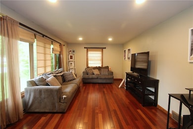 Large living room has great natural light and can