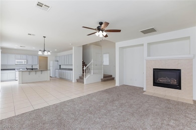 Unfurnished living room featuring stairs, ceiling