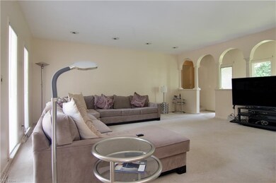Floor to ceiling windows continue in Family room.
