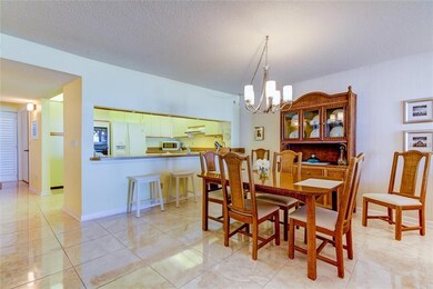 A view towards entry, kitchen and dining