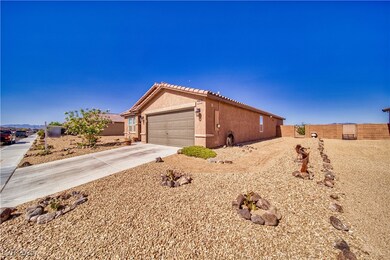 View of home's exterior featuring concrete drivewa
