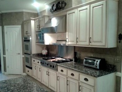 Viking gas cook top with warming shelf above. Doub