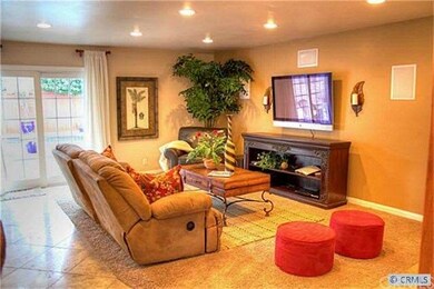 Spacious living room offers travertine flooring, r